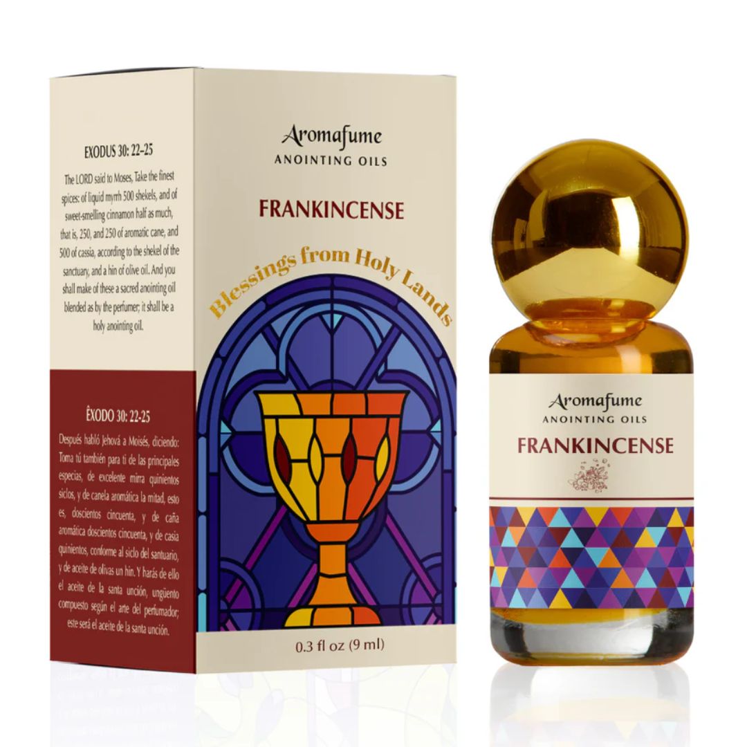 Amber glass bottle of frankincense anointing oil on natural wooden surface