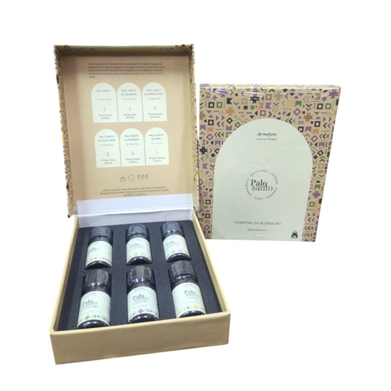 A gift pack containing six bottles of Aromafume Palo Santo essential oil blend, with a detailed label on the front showing the scent and properties of each blend.