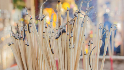 Opium incense sticks with ethereal smoke rising in serene meditation space, symbolizing spiritual awakening and inner peace.