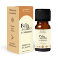 Amber glass bottle of Palo Santo and Cinnamon essential oil blend