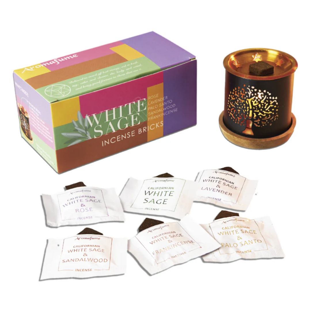White Sage incense bricks with packaging and a small candle on a white background