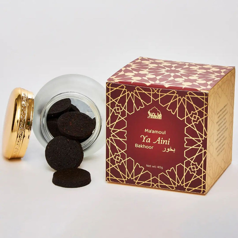 Ma'amoul Ya Aini Bakhoor with packaging on a white background