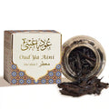 Oud Ya Aini incense packaging with jar of incense sticks on a white background