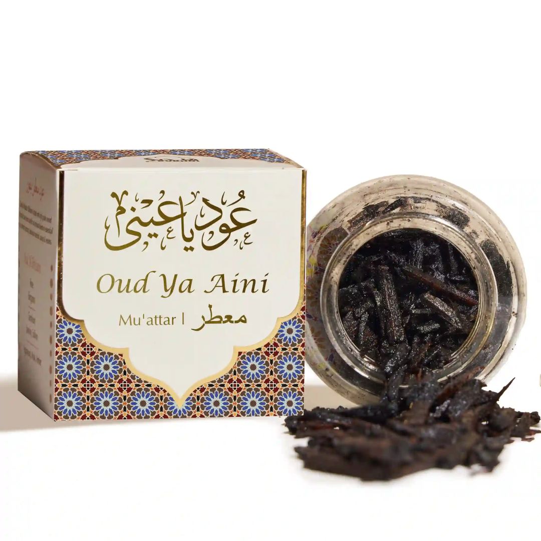 Oud Ya Aini incense packaging with jar of incense sticks on a white background