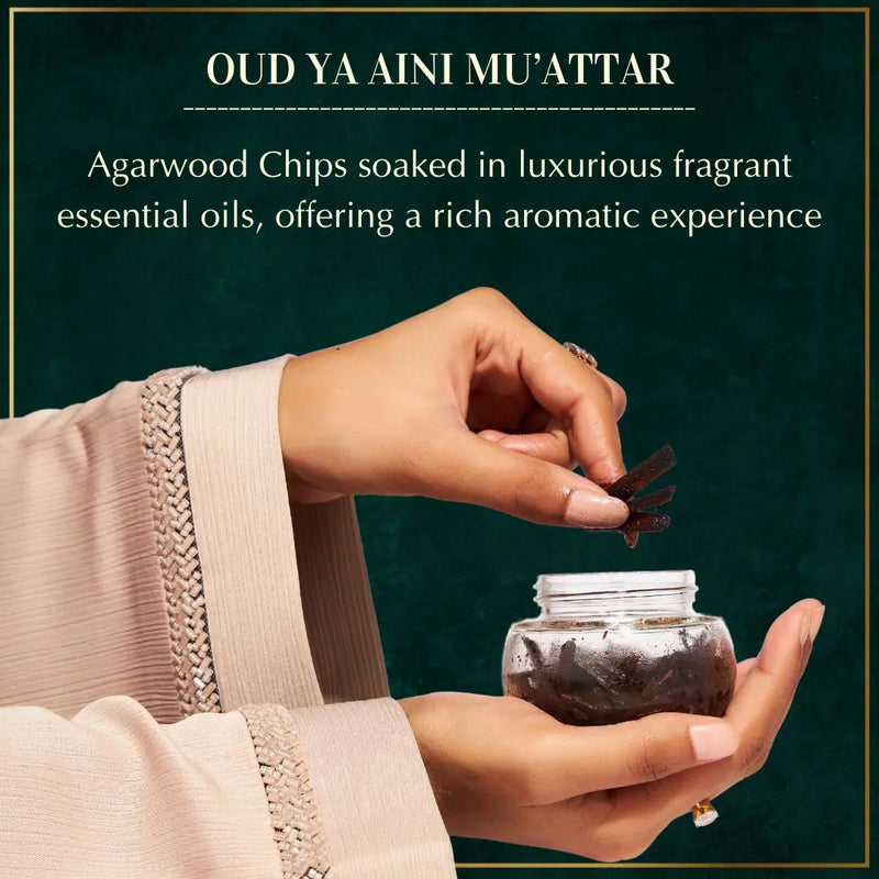 Oud Ya Aini incense packaging with jar of incense sticks on a white background