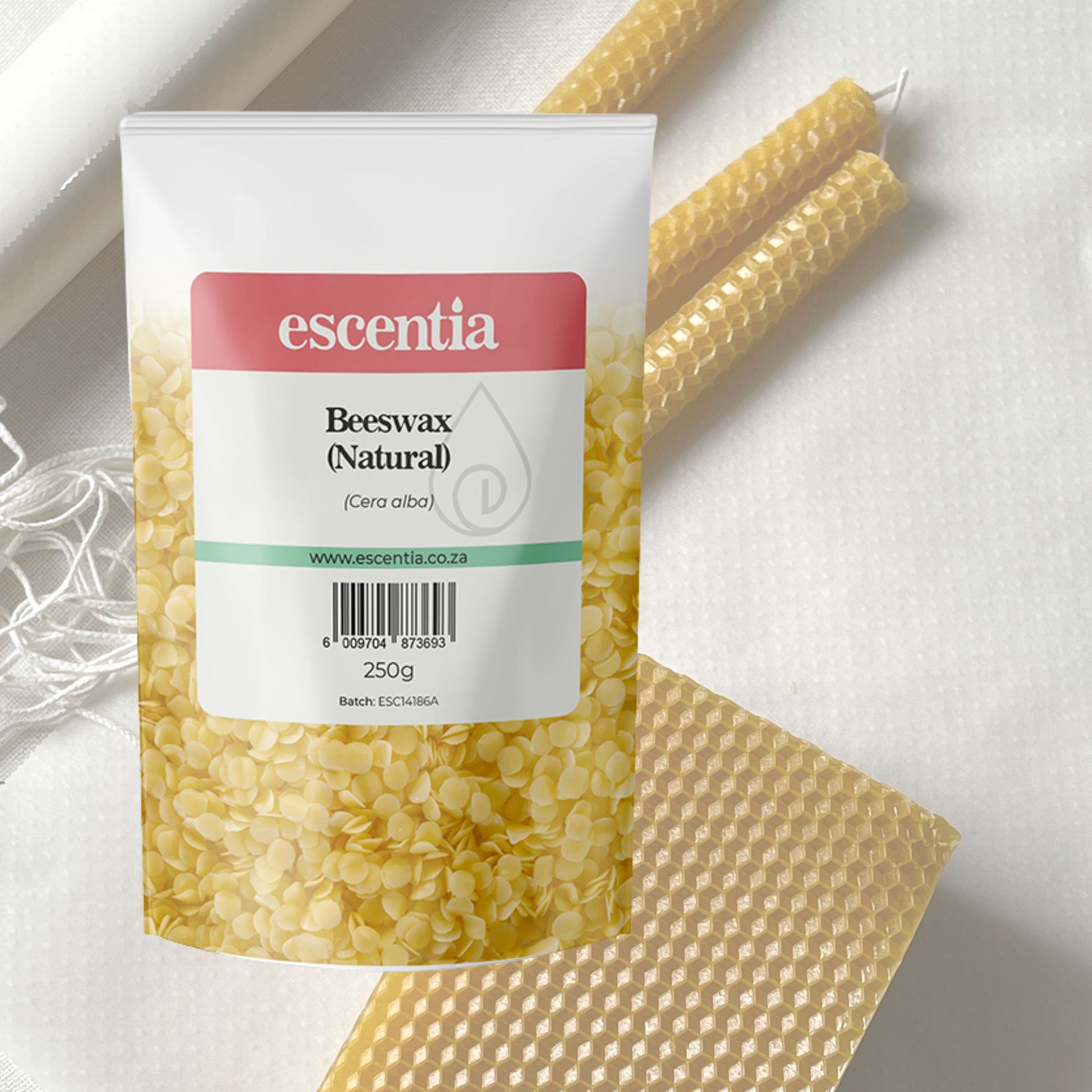 Packaged beeswax with Escentia branding on a light background