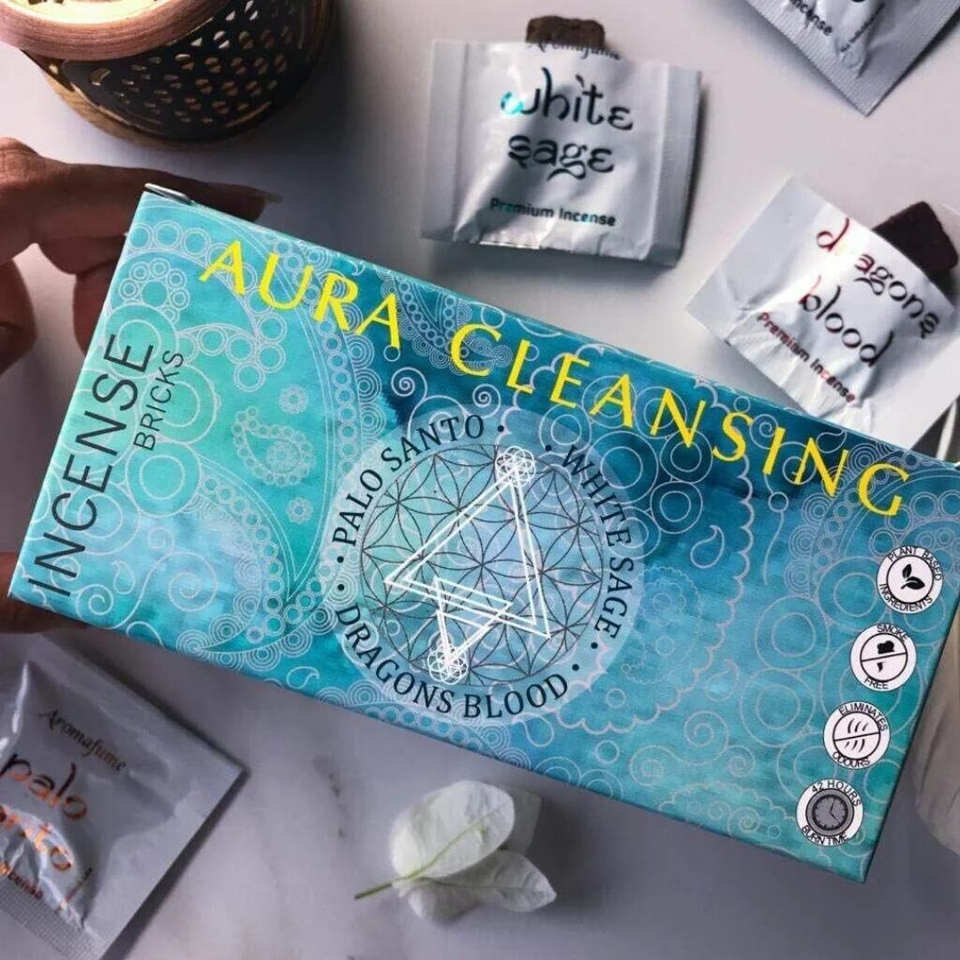 Aromafume Aura Cleansing kit with incense packets and diffuser on a white background
