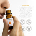 Amber bottle of Aromafume Sacral Chakra essential oil blend