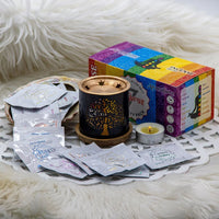 7 Chakra Incense burner with packets and a colorful box on a white fur background