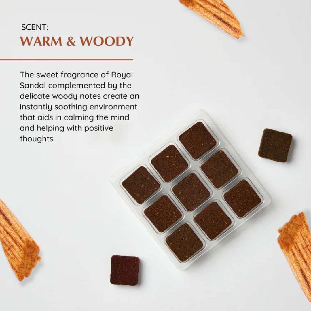 Brown square candles in a clear container with text about their scent on a light background