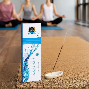 Alaukik Aquafresh incense sticks burning in a yoga studio – calming fragrance enhancing meditation and yoga practice