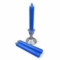 Blue ritual candle and candle holder on a white background