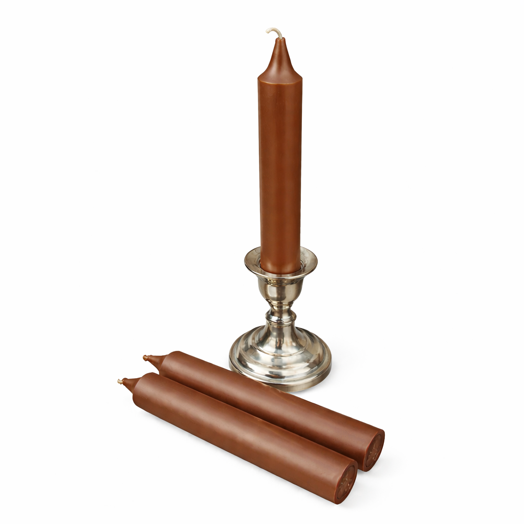 Brown ritual candles with a silver candlestick holder on a white background