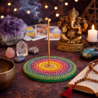 Colorful mandala  incense burner with smoke, crystals, and a statue on a dark surface. Secret Sense South Africa's leading Incense Supplier.