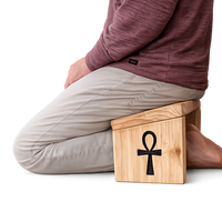 Person sitting on a Seiza oldable Meditation Chair handmade by Secret Sense South Africa.