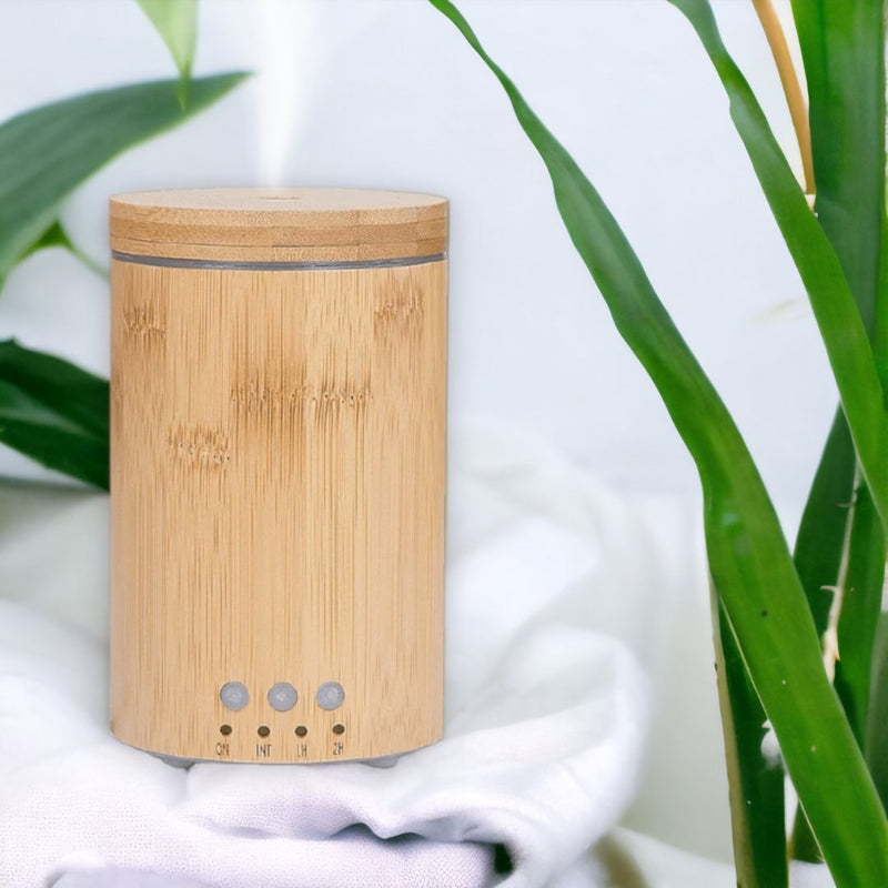 Escentia Bamboo Diffuser emitting a gentle mist, enhancing indoor and outdoor spaces