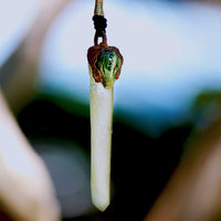 Person Holding Orbicular Jasper and Quartz Pendant for Meditation and Grounding