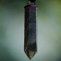 Bloodstone Crystal Pendant on Copper-Plated Loop against a White Background