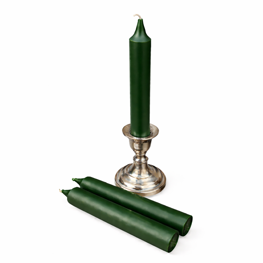 Green ritual candles with a silver candlestick holder on a white background