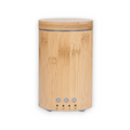 Escentia Bamboo Diffuser emitting a gentle mist, enhancing indoor and outdoor spaces