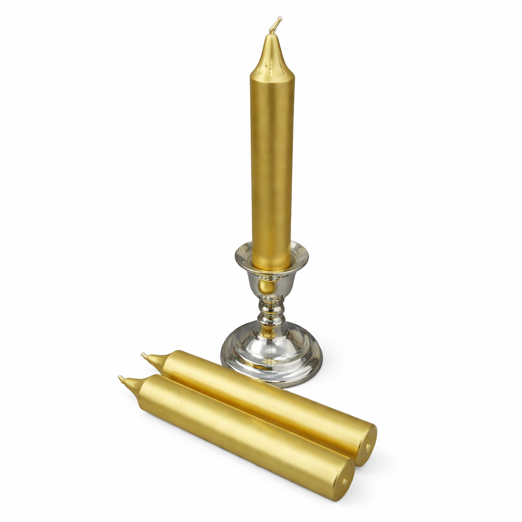 Gold ritual candle and silver candle holder on a white background