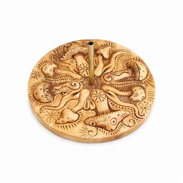 Decorative Mushroom Incense holder with intricate designs on a white background