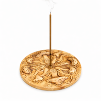 Resin incense burner with engraved mushroom designs on a white background