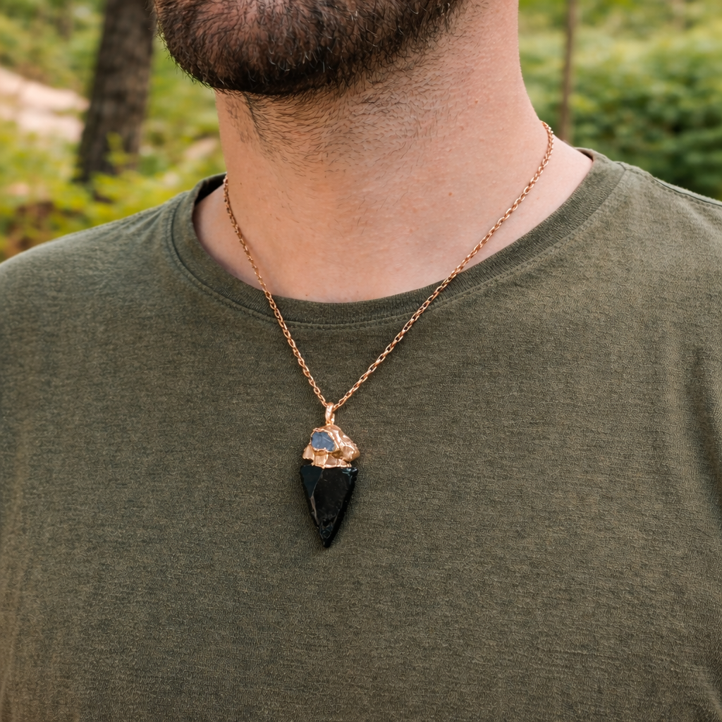 person wearing a Obsidian Crystal Arrowhead paired with a Sapphire capstone Crystal Pendant - South Africa
