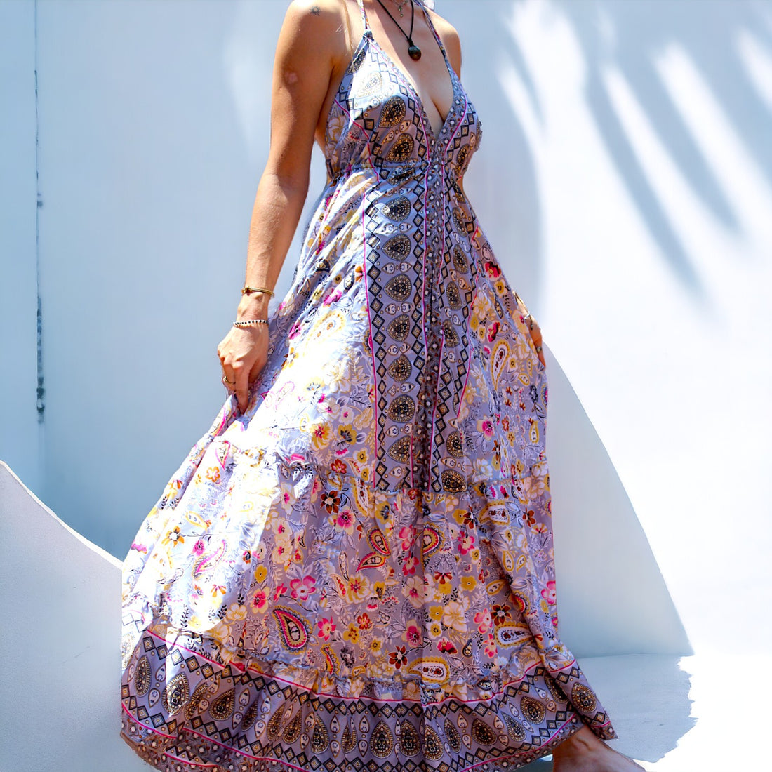 Woman in Secret Sense Bohemian Paisley Maxi Dress with intricate pastel patterns