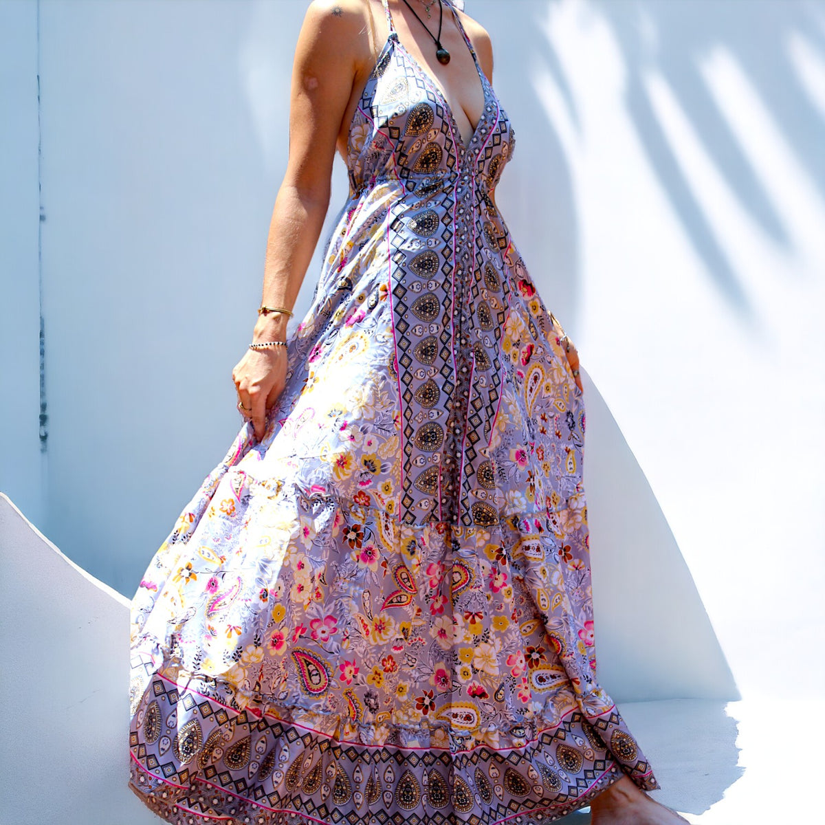 Woman in Secret Sense Bohemian Paisley Maxi Dress with intricate pastel patterns