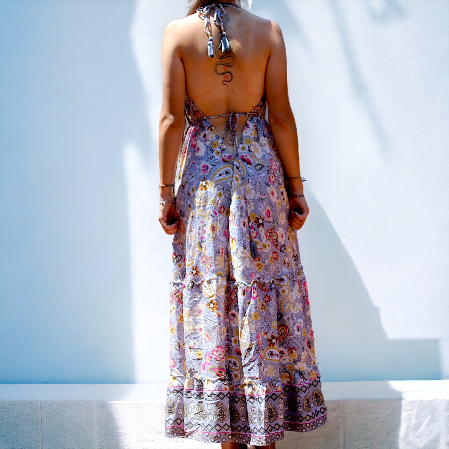 Woman in Secret Sense Bohemian Paisley Maxi Dress with intricate pastel patterns