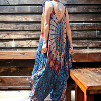 Model wearing Secret Sense Serenity Strap Jumpsuit in blue with mantra pattern