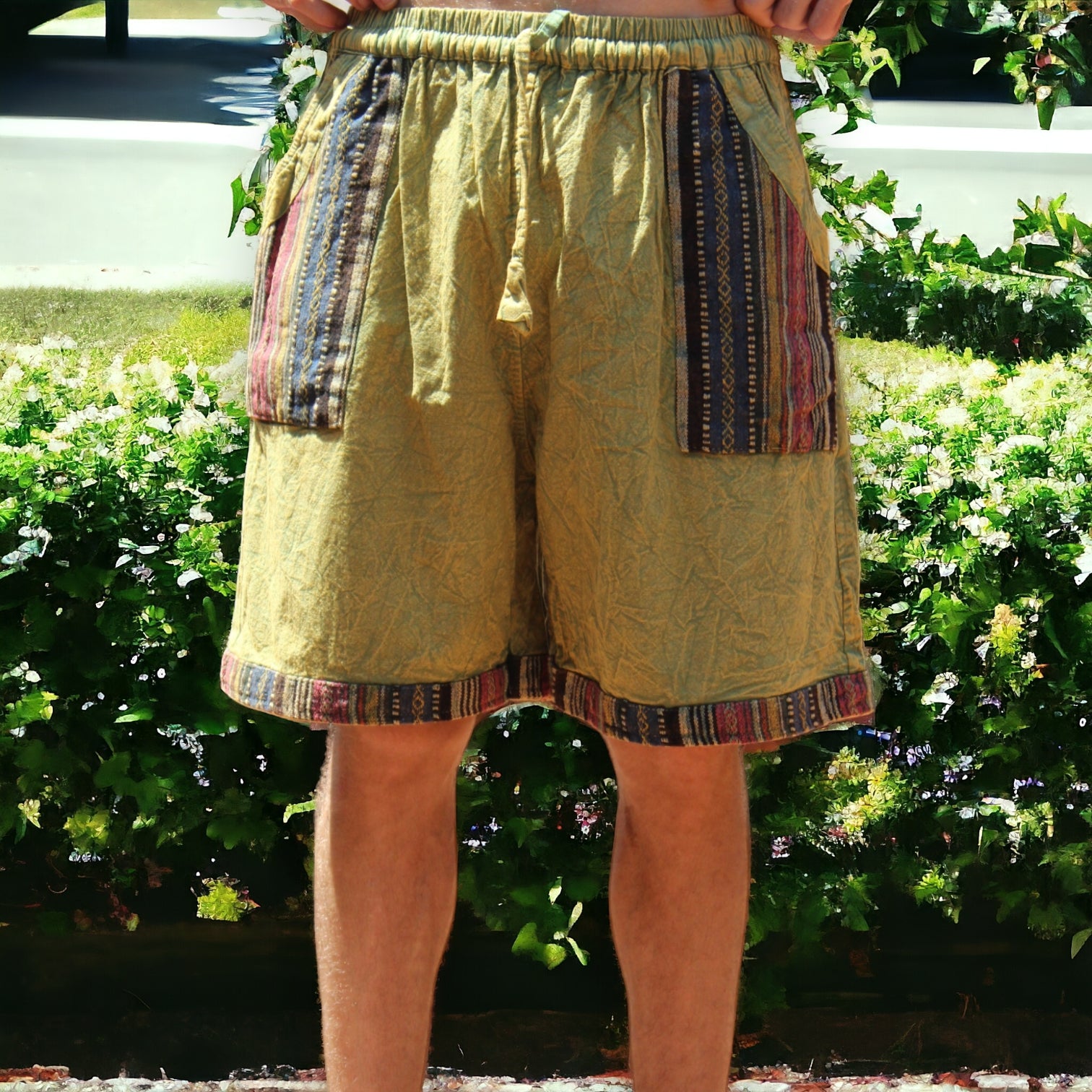 Man wearing Secret Sense Tribal Breeze Boho Shorts with earthy patterns