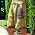 Man wearing Secret Sense Tribal Breeze Boho Shorts with earthy patterns