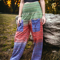 Colorful Secret Sense Forest Striped Harem Pants against a backdrop of dusk