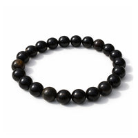 Black beaded bracelet on a white background