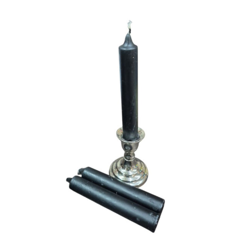 Black candle and candle holder on a white background